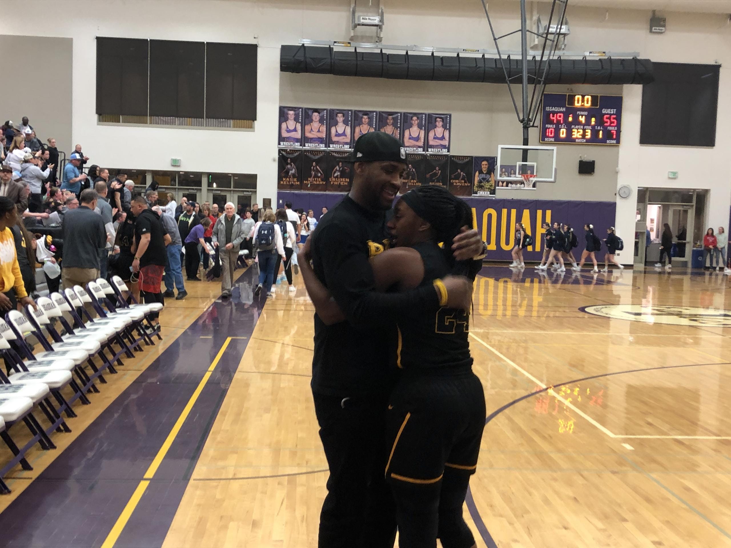 Hudson's Bay junior Kamelai Powell is embraced by her father, Kenan Powell, after the Eagles beat Meadowdale 55-49 on Saturday in the 3A state regionals at Issaquah.