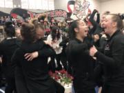 Camas High gymnasts celebrate after winning the WIAA 4A state title on Friday, Feb. 21, 2020, at Sammamish High School. It was their third state championship.
