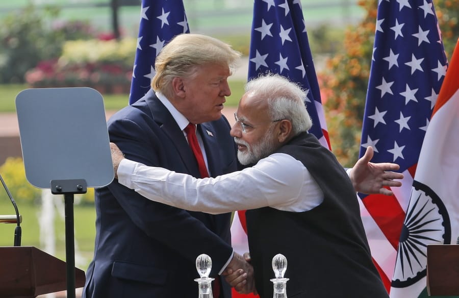 U.S. President Donald Trump and Indian Prime Minister Narendra Modi embrace after giving a joint statement in New Delhi, India, Tuesday, Feb. 25, 2020.