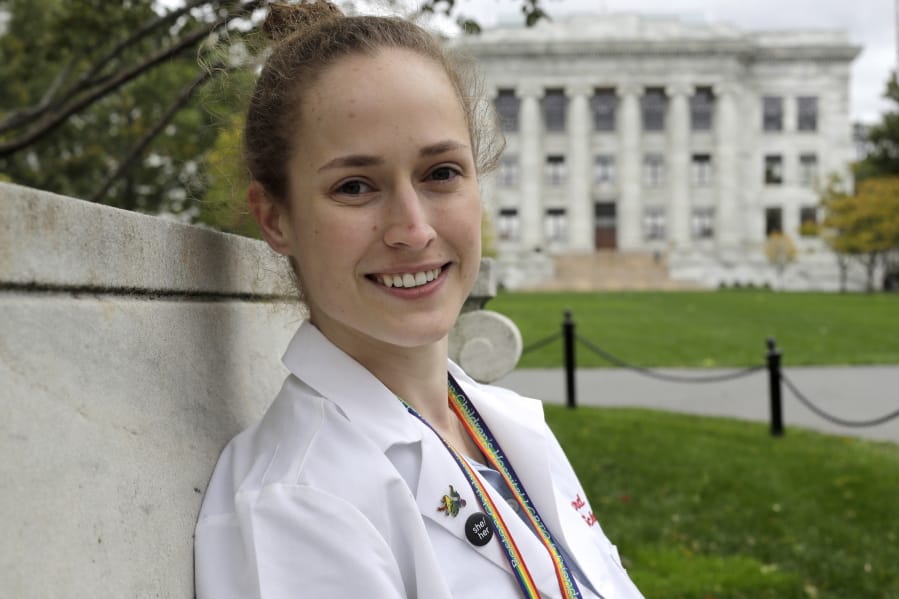In this Thursday, Oct. 17, 2019 photo Harvard Medical School student Aliya Feroe, of Minneapolis, Minn., poses for a photograph on the school&#039;s campus, in Boston. Feroe recalls a flustered OB-GYN who referred her to another physician after learning she identified as queer. Medical schools are beefing up education on LBGTQ health issues. And some schools are making a big push to recruit LGBTQ medical students, backed by research showing that patients often get better care when treated by doctors who are more like them.
