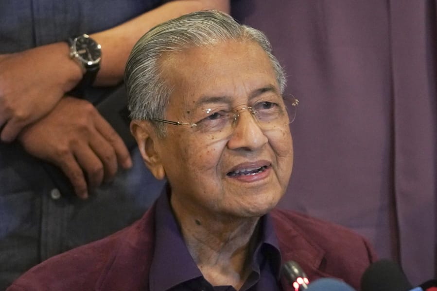 FILE - In this Feb. 22, 2020, file photo, Malaysian Prime Minister Mahathir Mohamad, speaks during a press conference in Putrajaya, Malaysia.