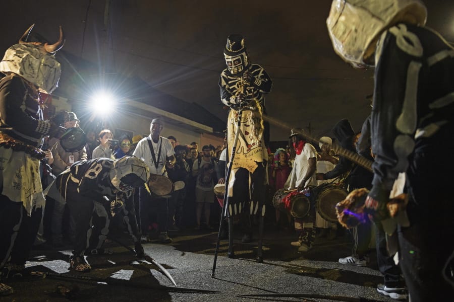 The North Side Skull &amp; Bones Gang rises before dawn, costumed as skeletons, to wake people up on Mardi Gras Day in New Orleans, La. Tuesday, Feb. 25, 2020.