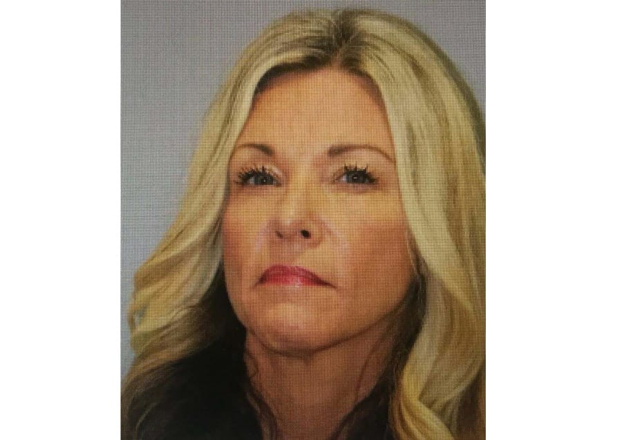 This booking photo provided by Kauai police shows  Lori Vallow.  Vallow, the mother of two Idaho children missing since September was arrested Thursday, Feb. 20, 2020 in Hawaii. Vallow, also known as Lori Daybell, 46, was arrested on a warrant issued in Madison County, Idaho, and was being held on $5 million bail, Kauai police said.