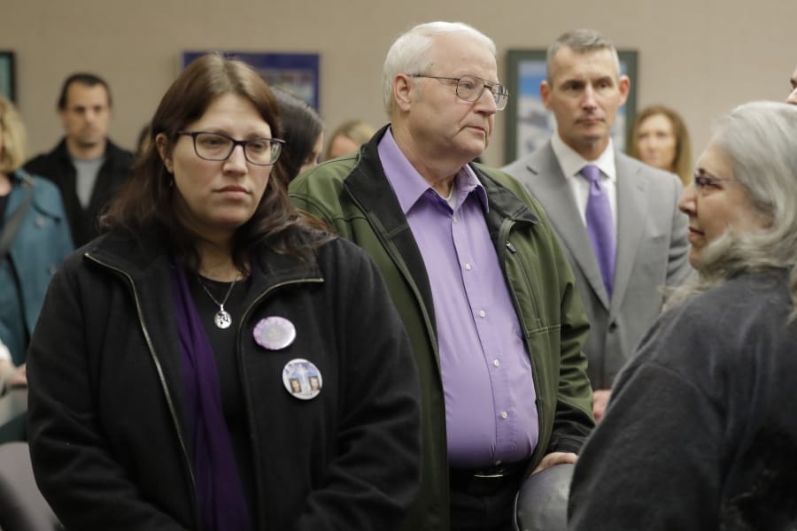 Chuck Cox, center, and his wife, Judy Cox, right, stand with their daughter, Denise Ernest, left, and their attorney, Ted Buck, second from right, Tuesday, Feb. 18, 2020, during a break in a session of Pierce County Superior Court in Tacoma, Wash., on the first day of a civil lawsuit over the murder of the Cox&#039;s young grandsons. Chuck and Judy are the parents of missing Utah woman Susan Cox Powell and the grandparents of Susan&#039;s sons Charlie and Braden, who were attacked and killed by their father Josh Powell in 2012 while he was under suspicion for Susan Powell&#039;s disappearance. The Coxes allege that negligence by the Washington state Department of Social and Health Services was a contributing factor that led to the deaths of their grandsons. (AP Photo/Ted S.