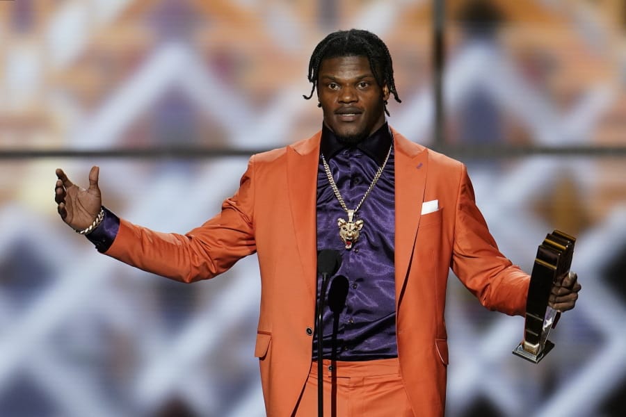 Baltimore Ravens&#039; Lamar Jackson speaks after winning the AP Most Valuable Player award at the NFL Honors football award show Saturday, Feb. 1, 2020, in Miami. (AP Photo/David J.