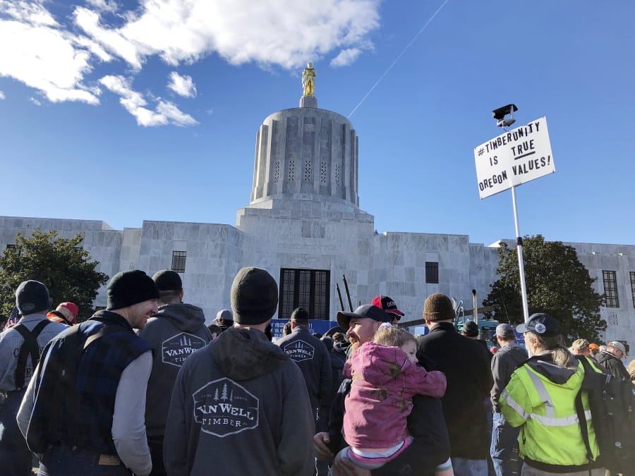 Demonstrators protest against a cap-and-trade bill aimed at stemming global warming on Thursday at the Oregon State Capitol in Salem.