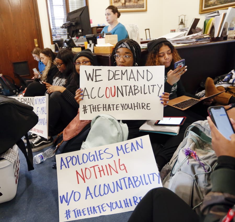 Oklahoma University students participate in a sit-in organized by the Black Emergency Response Team student group outside of the office of OU provost Kyle Harper in Evans Hall at the University of Oklahoma in Norman, Okla., Wednesday, Feb. 26, 2020. The protest comes after two incidents where faculty members used a racial slur while teaching.