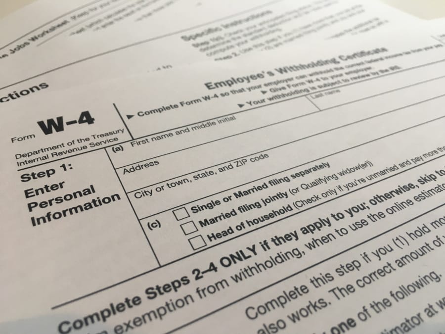 This Wednesday, Feb. 5, 2020 photo shows the W-4 form in New York.  The IRS has introduced a new Form W-4 that must be used by all employers in 2020 to better accommodate recent changes to the tax law. It&#039;s the biggest overhaul of the form in decades. It can require a bit more legwork but in return, the IRS says it will yield more accurate results.