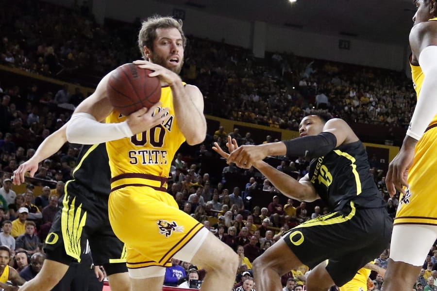 Arizona State&#039;s Mickey Mitchell (00) wins a loose ball against Oregon&#039;s Chandler Lawson (13) during the first half of an NCAA college basketball game Thursday, Feb. 20, 2020, in Tempe, Ariz.