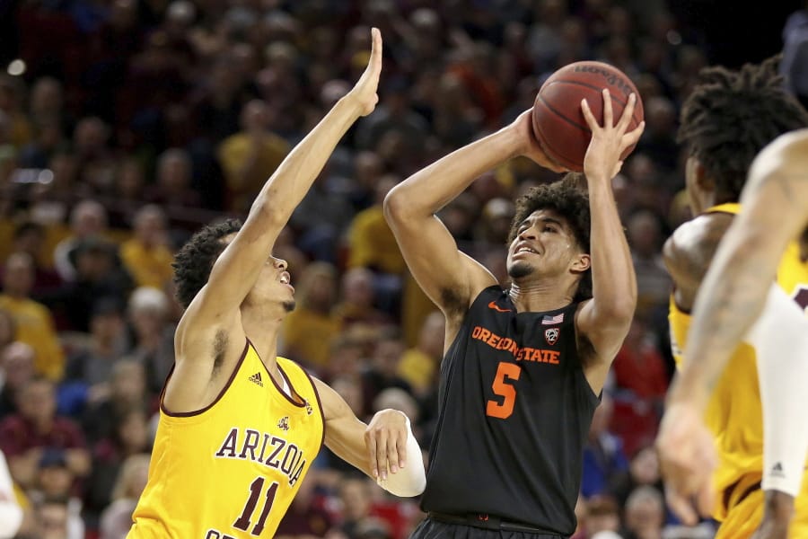 Oregon State&#039;s Ethan Thompson (5) looks to the basket against Arizona State&#039;s Alonzo Verge (11) during the first half of an NCAA college basketball game Saturday, Feb. 22, 2020, in Tempe, Ariz.