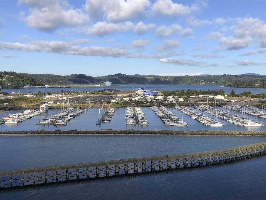 Oregon State University&#039;s Marine Studies Building, which is under construction in a tsunami inundation zone, is seen July 22 from the Yaquina Bay Bridge in Newport, Ore. The building, center right, is surrounded by Yaquina Bay. The Oregon Legislature appears poised to continue to allow construction of critical facilities in tsunami inundation zones, a move slammed by critics.