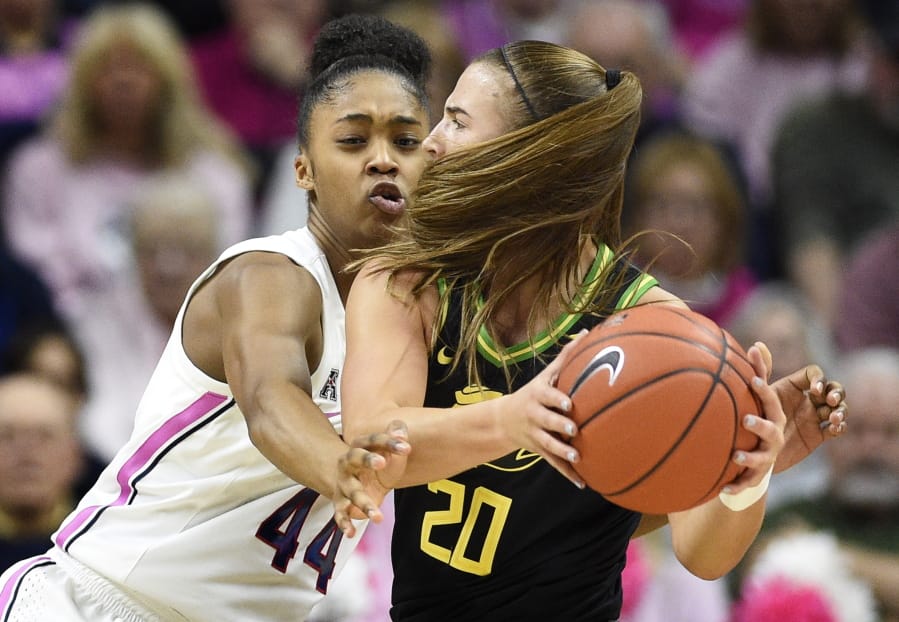 Connecticut&#039;s Aubrey Griffin, left, pressures Oregon&#039;s Sabrina Ionescu, right, in the first half of an NCAA college basketball game, Monday, Feb. 3, 2020, in Storrs, Conn.