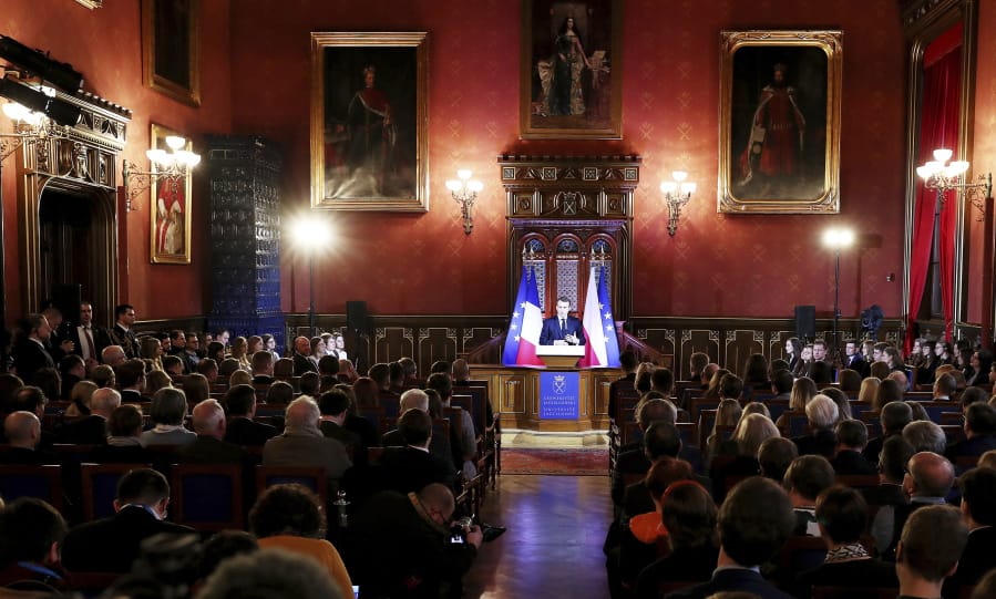 French President Emmanuel Macron delivers his speech to students and intellectuals at the Jagiellonian University for a lecture on the future of a united Europe in Krakow, Poland, Tuesday, Feb.