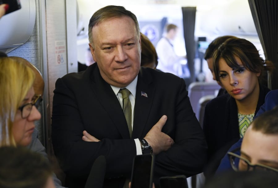 Secretary of State Mike Pompeo takes questions from reporters during a flight from Andrews Air Force Base, Md., to Germany, Thursday, February 13, 2020. Pompeo on Thursday said he is &quot;outraged&quot; by the U.N.&#039;s publication of a list of companies accused of violating Palestinian human rights by operating in Israel&#039;s West Bank settlements.