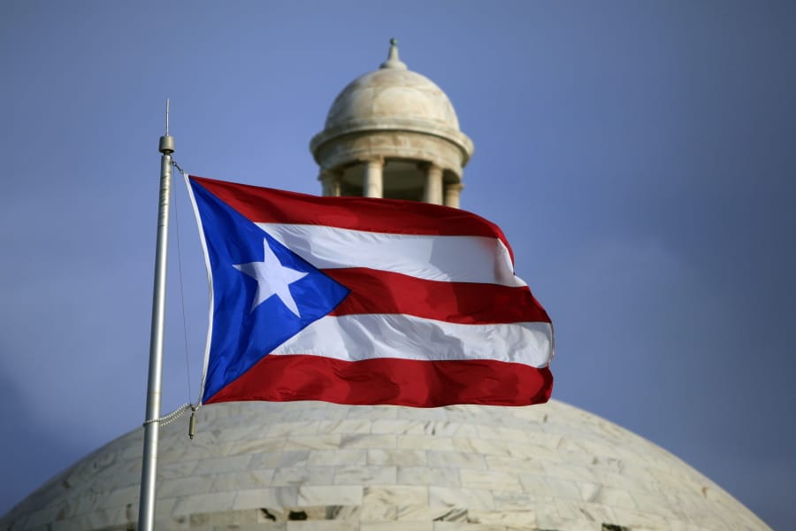 FILE - In this July 29, 2015 file photo, the Puerto Rican flag flies in front of Puerto Rico&#039;s Capitol as in San Juan, Puerto Rico. A senior Puerto Ricon official said Tuesday, Feb. 11, 2020, that the island&#039;s government has lost more than $2.6 million after falling for an email phishing scam.