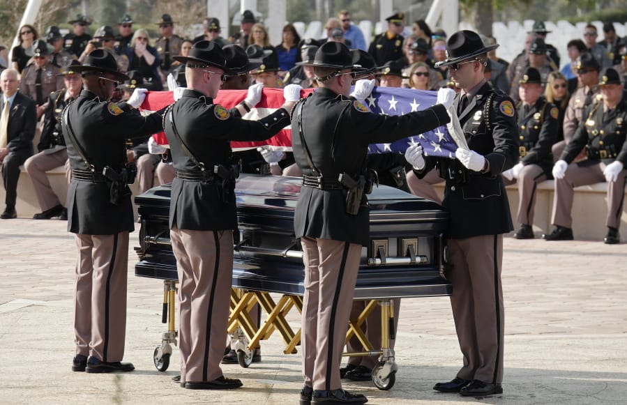 Folding of the American flag for slain Florida Highway Patrol Trooper Joseph Bullock at Sarasota National Cemetery on Thursday, Feb. 13, 2020. Trooper Bullock was shot and killed in the line of duty last week when he stopped to help a motorist.