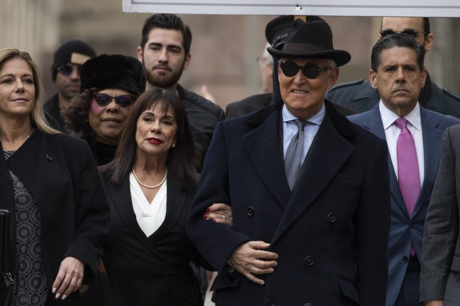 Roger Stone with accompanied by his wife Nydia Stone, second from left, arrives at federal court in Washington, Thursday, Feb. 20, 2020. Roger Stone, a staunch ally of President Donald Trump, faces sentencing Thursday on his convictions for witness tampering and lying to Congress.