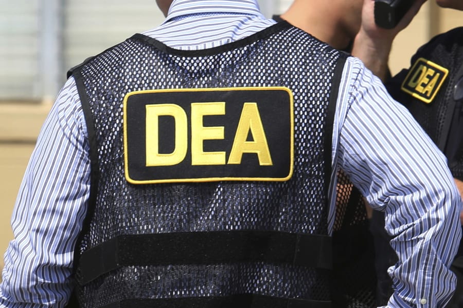 FILE - This June 13, 2016 file photo shows Drug Enforcement Administration (DEA) agents in Florida. On Friday, Feb. 21, 2020, the FBI arrested U.S. federal narcotics agent Jose Irizarry and his wife, Nathalia Gomez Irizarry, at their residence in Puerto Rico, according to a law enforcement official familiar with the arrest. He has been charged with conspiring to launder money with the very same Colombian drug cartels he was supposed to be fighting.
