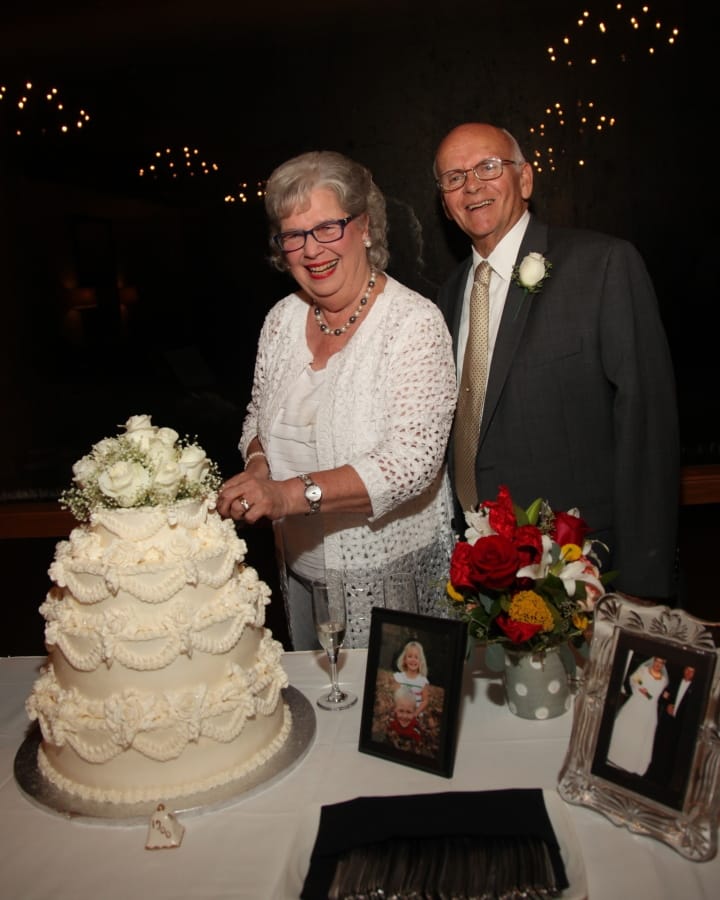 Mary Gammell and her husband, Ron, cutting the cake during their 50th wedding anniversary Aug. 13, 2016, in Tyler, Texas. Mary and Ron met when they were camp counselors and fell in love. They&#039;ve now been married over 50 years.