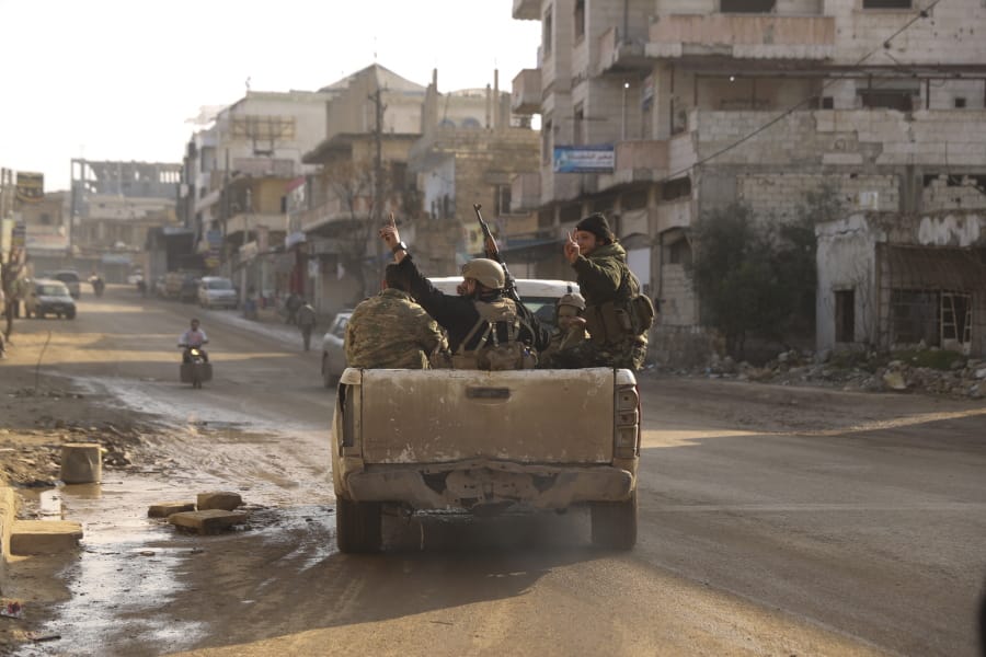 Syrian rebel drive toward the government positions near the village of Nerab, in Idlib province, Thursday, Feb. 6, 2020. Turkey sent more reinforcements into northwestern Syria on Thursday, setting up new positions in an attempt to stop a Syrian government offensive on the last rebel stronghold in the war-torn country, state media and opposition activists said.
