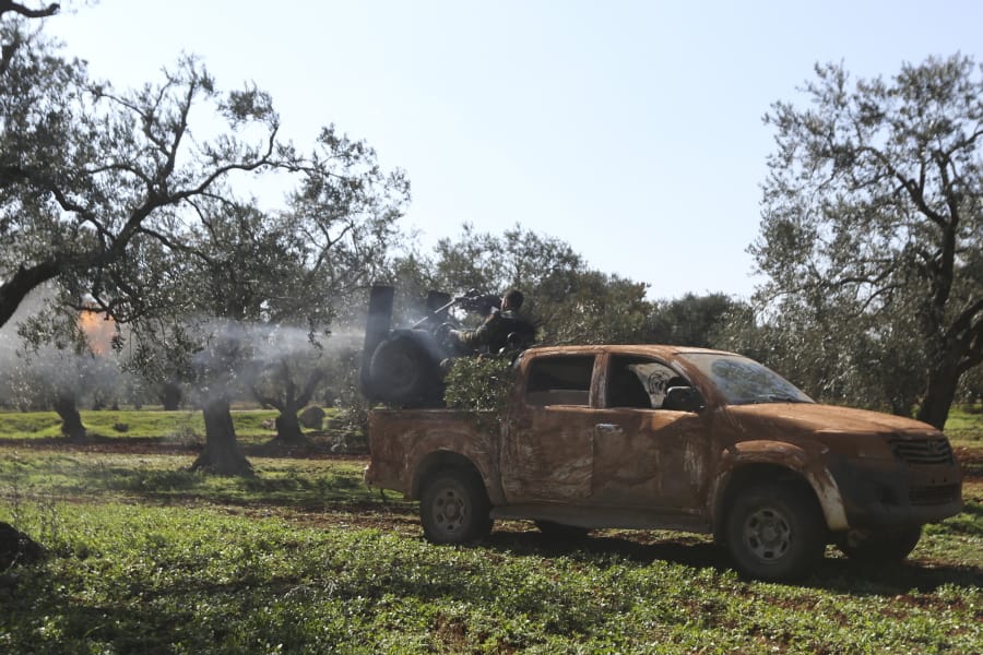 Turkish backed rebel fighters fire heavy machine gun near the village of Neirab in Idlib province, Syria, Thursday, Feb. 20, 2020. Two Turkish soldiers were killed Thursday by an airstrike in northwestern Syria, according to Turkey&#039;s Defense Ministry, following a large-scale attack by Ankara-backed opposition forces that targeted Syrian government troops.