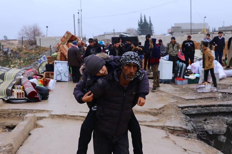 This photo provided on Jan. 30, 2020, by the Northern Democratic Brigade, a group of the US-backed Kurdish-led Syrian democratic forces, shows displaced Syrians fleeing the Syrian military offensive in Idlib province, as they arrive in Manbij town, north Syria. Hundreds of thousands of Syrians have fled recent government bombardment of the last rebel bastion, the northwestern Idlib province, seeking shelter from harsh winter weather in muddy tents and half-constructed buildings. As government forces advance, areas deemed safe are rapidly shrinking.