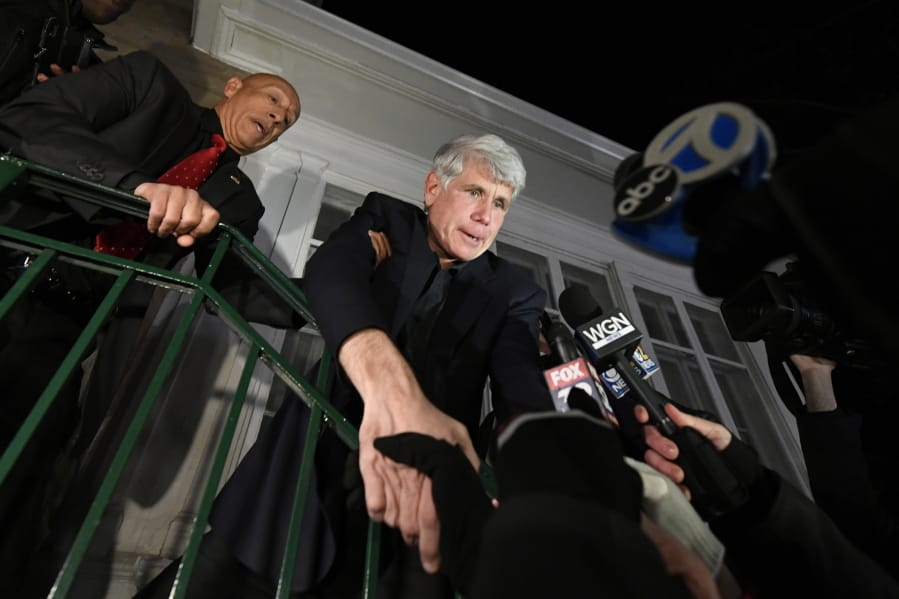Former Illinois Gov. Rod Blagojevich shakes hands with a supporter as he arrives home in Chicago on Wednesday, Feb. 19, 2020, after his release from Colorado prison late Tuesday. Blagojevich walked out of prison Tuesday after President Donald Trump cut short the 14-year prison sentence handed to the former Illinois governor for political corruption.