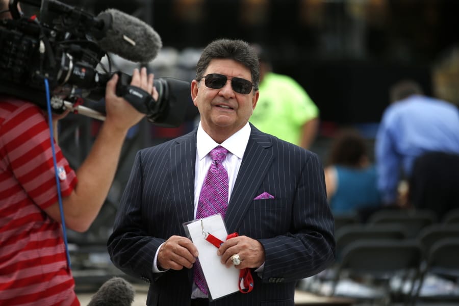 FILE - In this Aug. 8, 2015, file photo former owner of the San Francisco 49ers Edward DeBartolo, Jr., is interviewed before the Pro Football Hall of Fame ceremony at Tom Benson Hall of Fame Stadium in Canton, Ohio. President Donald Trump pardoned DeBartolo, who is convicted in gambling fraud scandal. (AP Photo/Gene J.