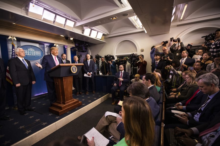 President Donald Trump with Vice President Mike Pence, left, and members of the president&#039;s coronavirus task force speaks during a news conference at the Brady press briefing room of the White House, Wednesday, Feb. 26, 2020, in Washington.