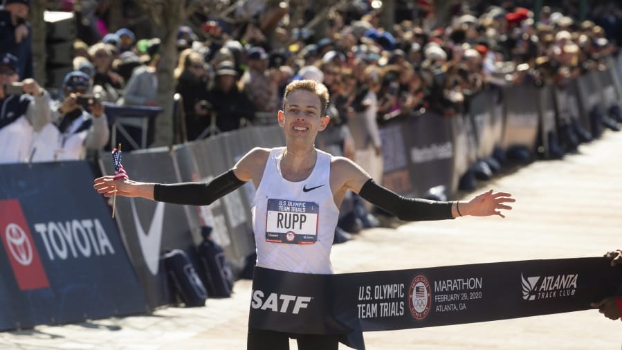 Galen Rupp crosses the finish line to win the U.S. Olympic marathon trials, Saturday, Feb. 29, 2020, in Atlanta.