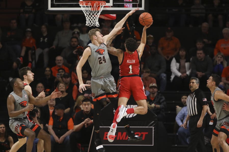 Oregon State&#039;s Kylor Kelley (24) blocks a shot by Utah&#039;s Timmy Allen (1) during the first half of an NCAA college basketball game in Corvallis, Ore., Thursday, Feb. 13, 2020.