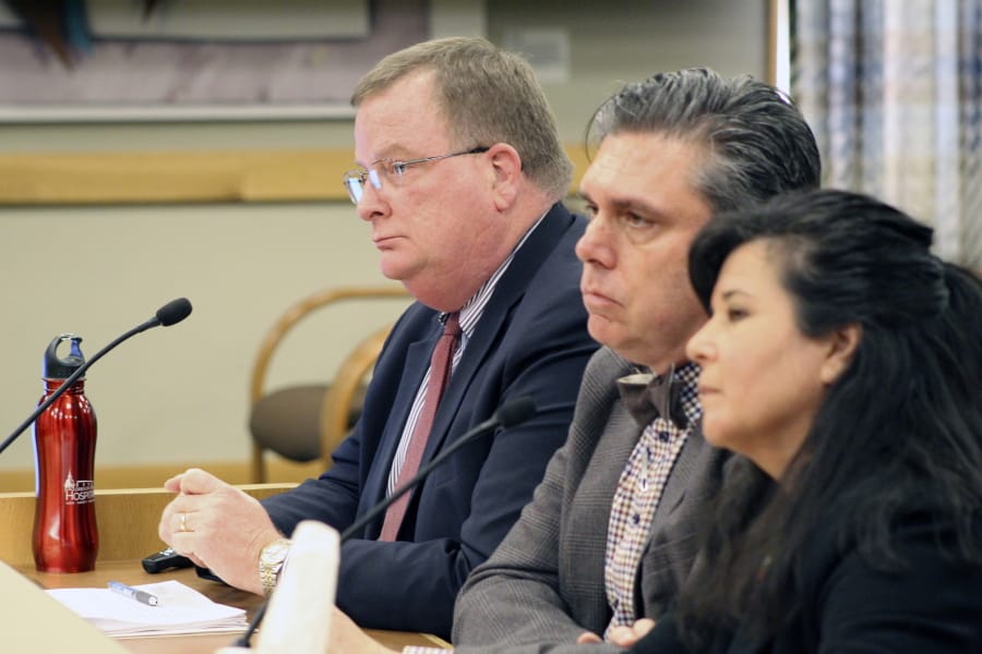 Three officials of the Oregon Health Authority testified on Friday, Feb. 28, 2020, before a committee of the Oregon Legislature in Salem, on preparations for a possible outbreak of coronavirus in Oregon. Appearing before the House Committee on Health Care were, from left, OHA Director Patrick Allen, Dean Sidelinger, state health officer and state epidemiologist, and Akiko Saito, section manager of health security, preparedness and response.