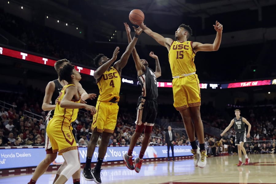 Southern California&#039;s Isaiah Mobley (15) grabs a rebound next to Washington State&#039;s Marvin Cannon during the second half of an NCAA college basketball game Saturday, Feb. 15, 2020, in Los Angeles.