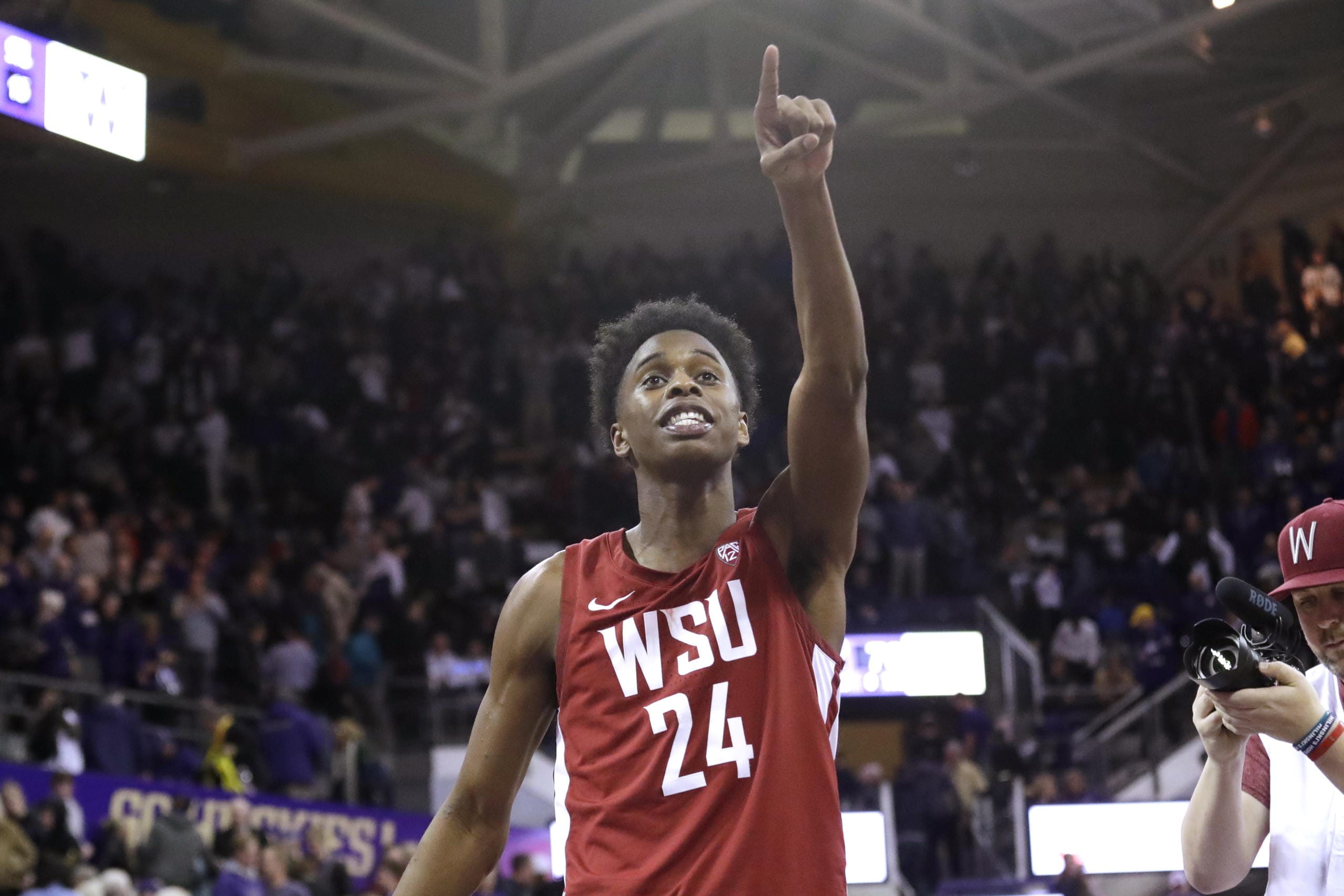 Washington State's Noah Williams points toward the stands after Washington State defeated Washington 78-74 in an NCAA college basketball game Friday, Feb. 28, 2020, in Seattle.