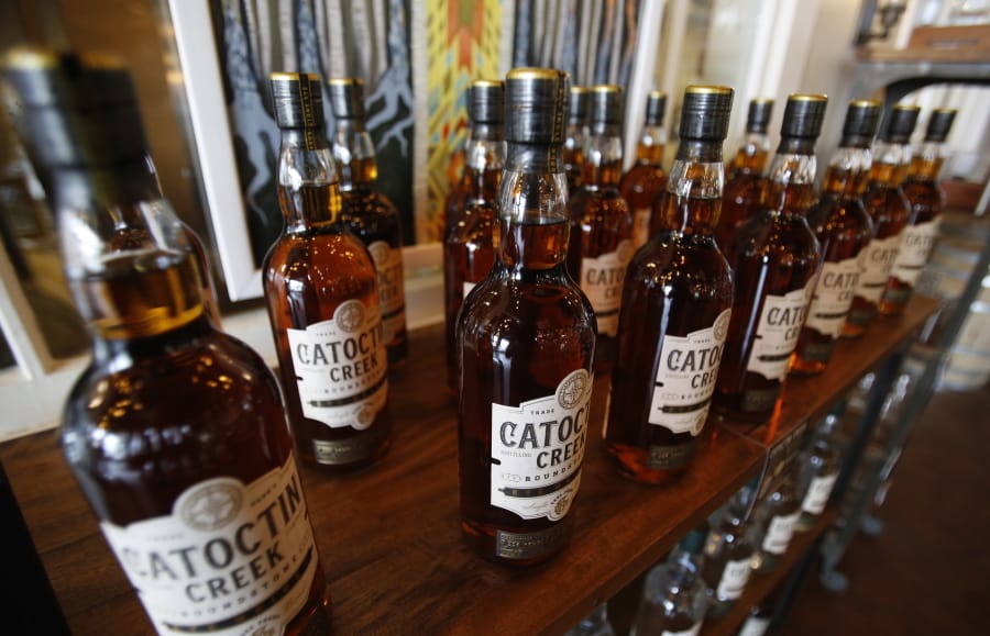 Catoctin Creek Distillery whiskey is on display in a tasting room June 20, 2018, in Purcellville, Va.