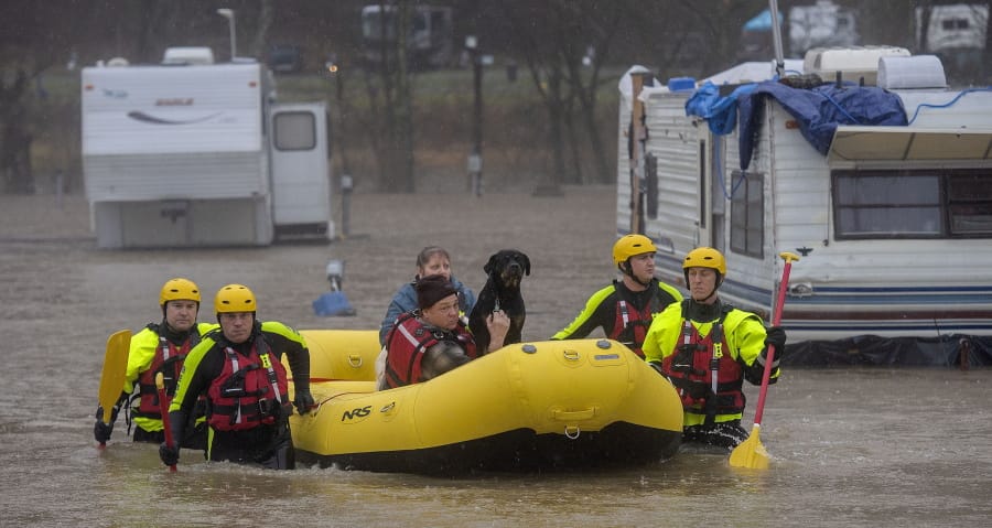 The Bristol Tennessee Fire Department&#039;s Swift Water Rescue team brings a couple and their 3 dogs to safety after the Shadrack Campgrounds flooded Thursday, Feb. 6, 2020 in Bristol Tennessee.