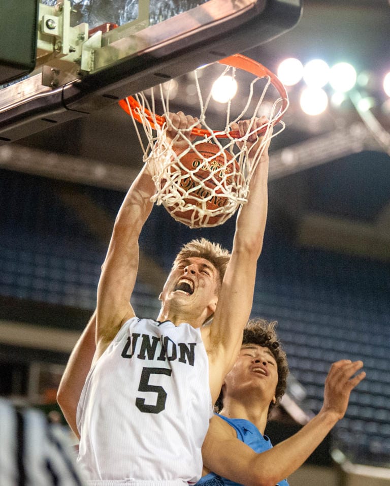 Union's Tanner Toolson dunks the ball late in the fourth quarter of a 4A State semifinal game on Friday at the Tacoma Dome. Union lost 63-55.