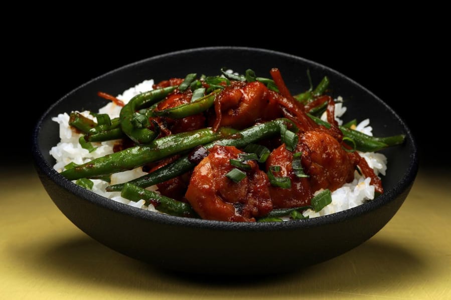 Spicy chile crisp is an great way to punch up a chicken dinner. Try this recipe for chile crisp chicken with shallots and green beans.