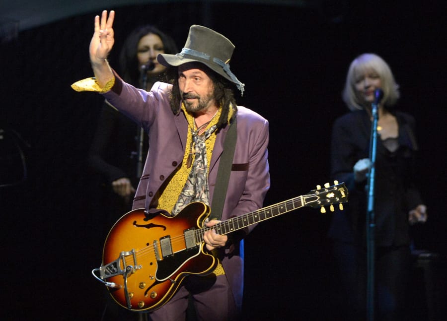 Mike Campbell, formerly of Tom Petty and the Heartbreakers, waves to fans as he performs with Fleetwood Mac on Feb. 24, 2019, at Spectrum Center in Charlotte, N.C.