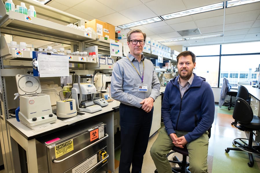 Dr. Keith Jerome, left, director of the UW Medicine Virology laboratory in Seattle, and Dr. Alex Greninger, assistant director of the lab, quickly ramped up a test to detect the new coronavirus. As of March 11, their lab had performed nearly 3,000 tests, with about 270 found to be positive.