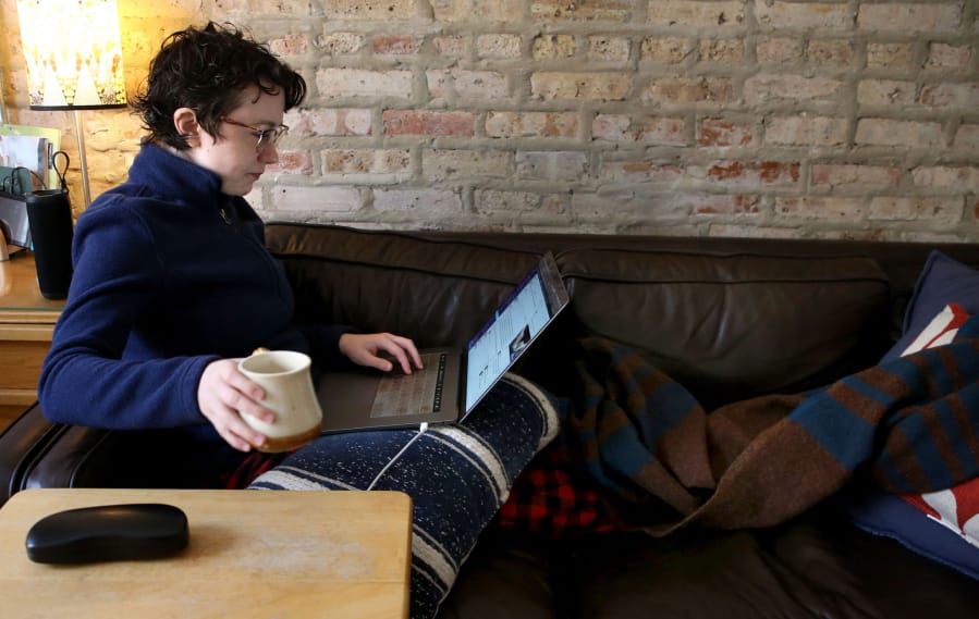 Glitch.com software engineer Melissa McEwen, 33, works from her Logan Square neighborhood home on March 12. McEwen has worked remotely for five years.