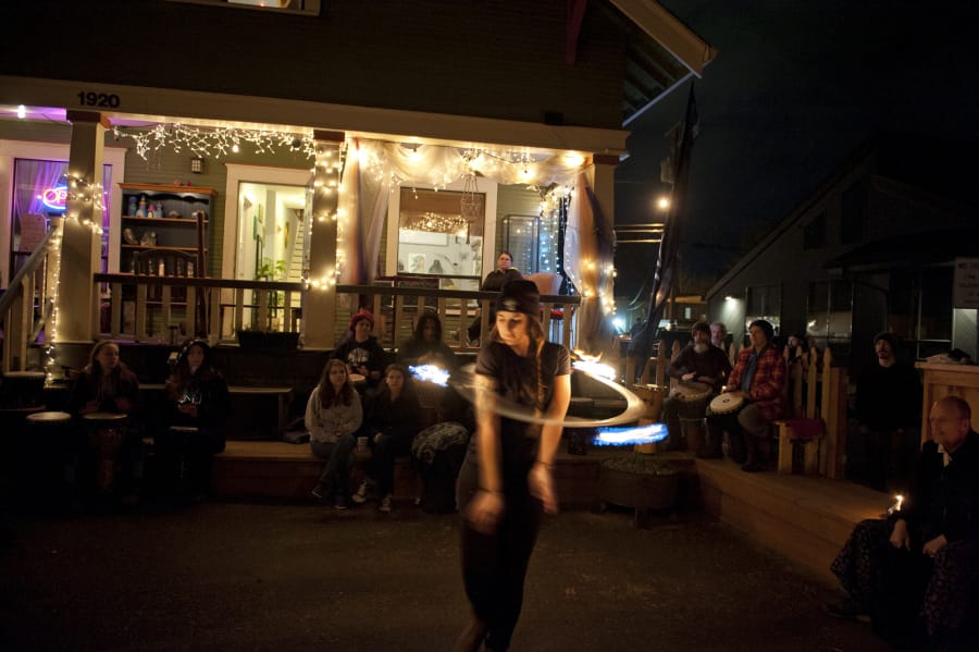 Jozee Becher, of Vancouver, works with a flaming hoop at Wattle Tree Place.