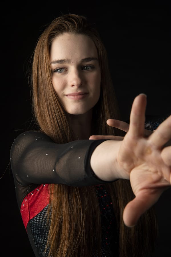All-Region gymnast Shea McGee of Camas also competes in diving during the fall and in the pole vault in spring to help her gymnastics skills in the winter season.