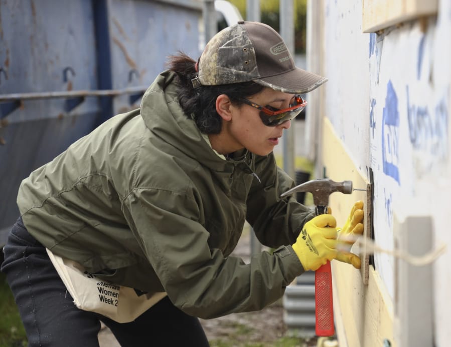 Tsering Wangden volunteers on a construction site near uptown as part of Habitat for Humanity&#039;s International Women Build Week 2020 on Saturday. Habitat for Humanity estimates 6,000 volunteers in 235 communities across the globe will work on a Women Build site. Women Build Week ends Sunday.