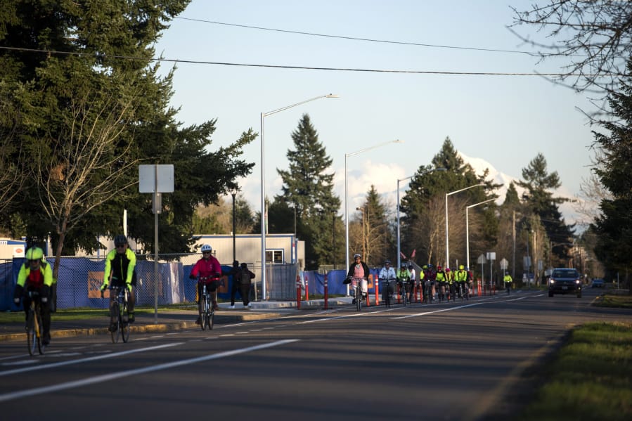 A guided, safety-oriented outing hosted by the Vancouver Bicycle Club heads along MacArthur Boulevard in Vancouver. Organizer and ride leader Jan Verrinder said the weekly Monday night event aims to teach road cycling skills and safety tips, building confidence in adults who want to get back into urban cycling.