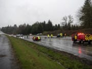 All lanes of state Highway 503 in Brush Prairie are blocked while law enforcement investigates a crash that killed three people and critically injured two children on Friday. The red car was traveling northbound on Highway 503 and tried to pass traffic on the left using the southbound lane, hitting the minivan head-on, according to the Washington State Patrol.