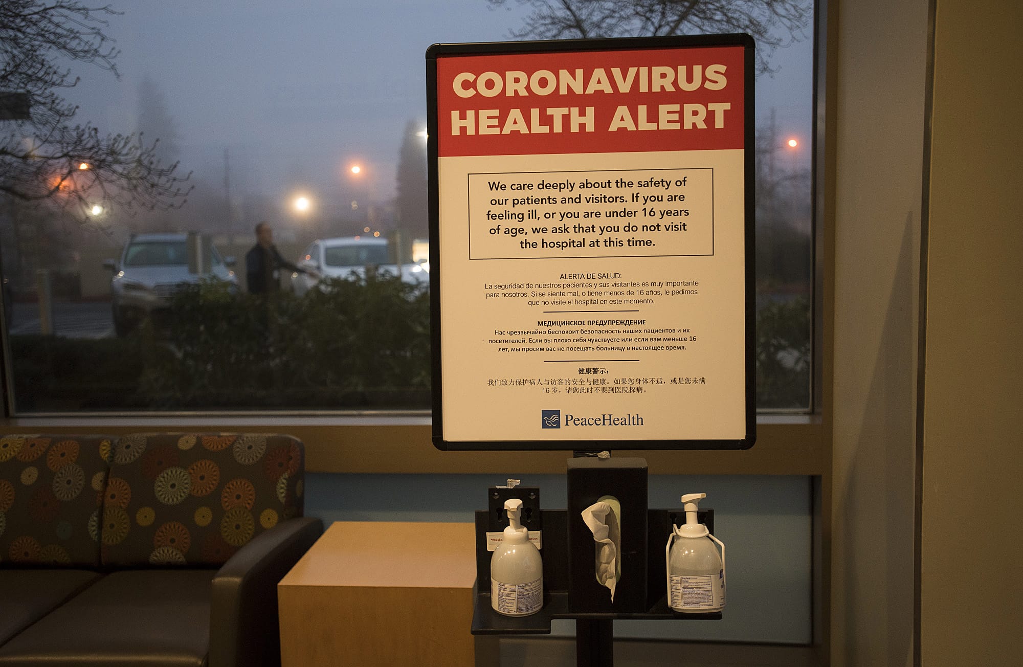 A coronavirus health alert sign is posted at one of the entrances to the Firstenburg Tower on Monday morning at PeaceHealth Southwest Medical Center.