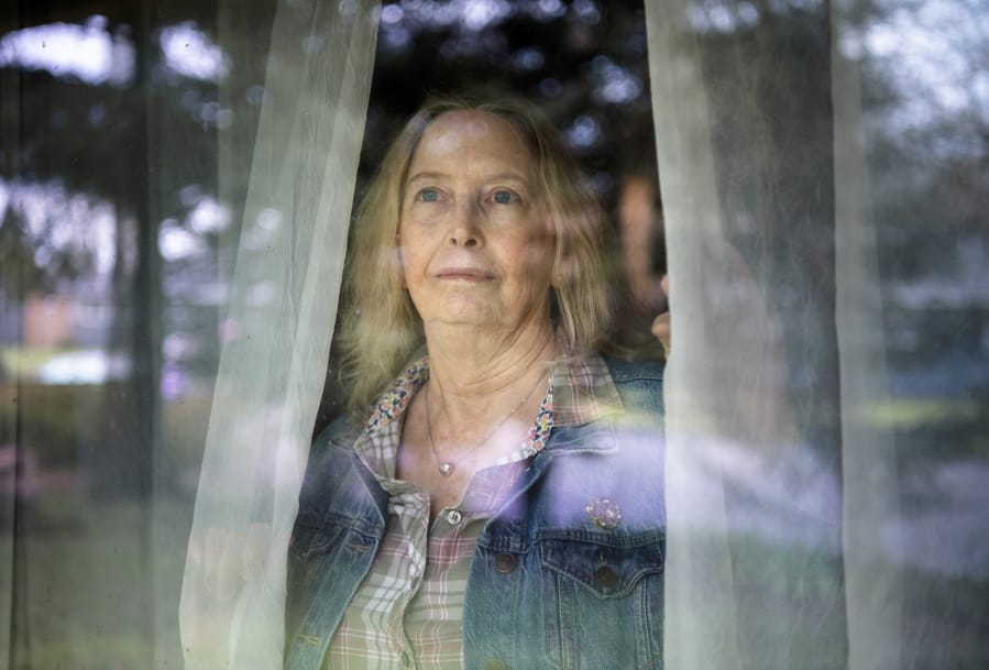 Denise Weston looks out the window at her home in Vancouver. Weston, who has bipolar II, has set up a virtual meeting for her next therapy next session. The tools she&#039;s learned from counseling have helped her during this time of added stress, Weston said. Some therapists in Clark County have shifted to virtual appointments to stop the spread of COVID-19.
