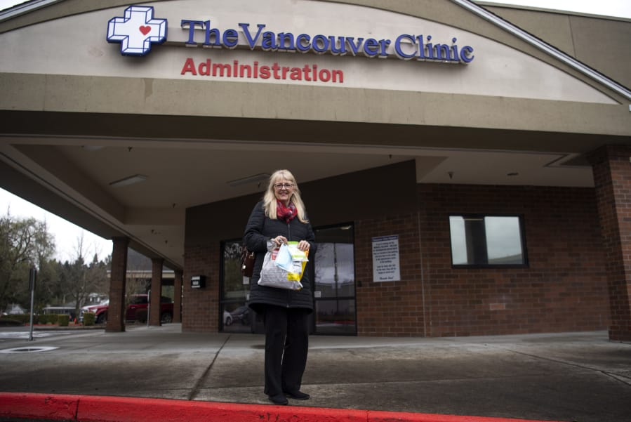 Nancy Bowser of Vancouver stands outside Vancouver Clinic&#039;s administrative office. A family friend in China sent Bowser 100 surgical masks and 10 N95 respirator masks from China. Bowser decided to donate them to Vancouver Clinic, which is short of masks. A spokeswoman for the clinic said it has received nearly 10,000 donated masks in the past week.