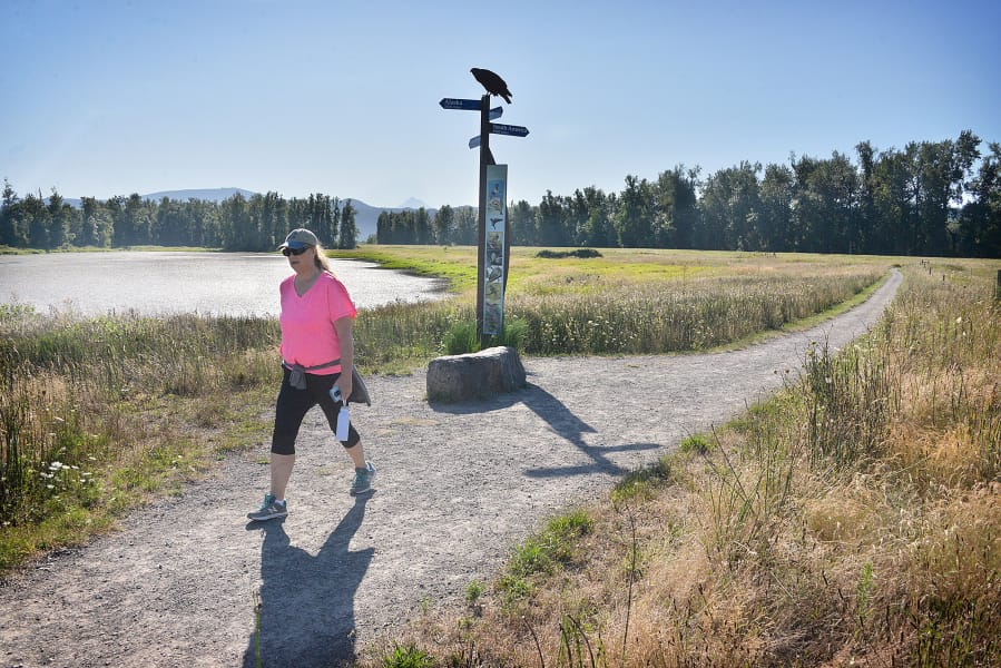 Judy Byron of Washougal takes a morning hike at Steigerwald Lake National Wildlife Refuge in 2019.